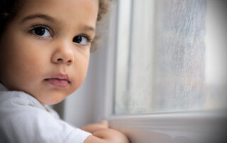 Child by a window