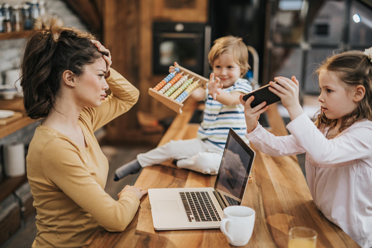 mother with children at a table working